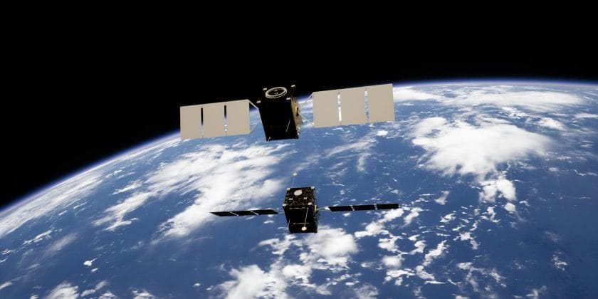 a satellite satellite flying over the earth