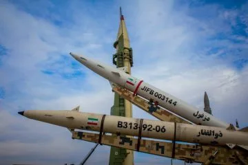 A group of fighter jets sitting on top of each other